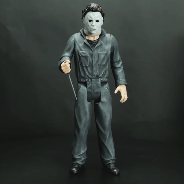 360 degree video of Giant Size Michael Myers figure.  Wearing Halloween (1978) Michael Myers mask, blue coveralls, black boots. holding a kitchen knife in right hand. 